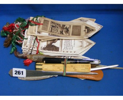 A collection of letter openers and rulers, plus a collection of vintage bookmarks.  