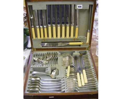 An oak canteen of Wright & Co. silver-plated cutlery with bone handles (some missing).