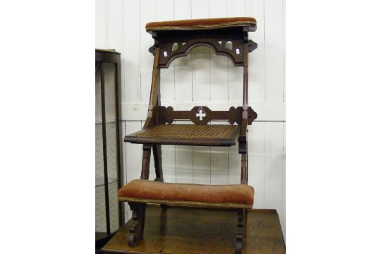 An Antique Folding Prayer Chair In A Gothic Style. Auction date: - An Antique Folding Prayer Chair In A Gothic Style.