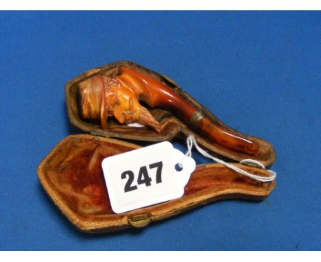 An antique Meerschaum pipe of a Civil War soldier with amber stem and original case.
