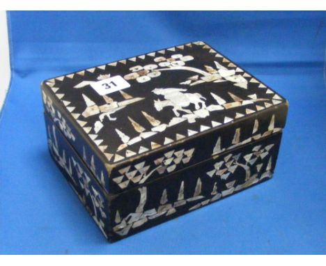 A good quality black lacquered box having mother of pearl inlay depicting Oriental scenes.
