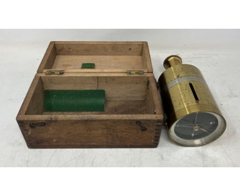 A brass hand held compass, 17 cm high, boxed, and four other compasses (5) 