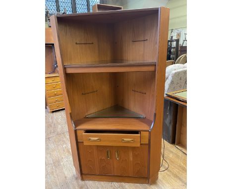 A teak corner cupboard, a draw leaf dining table, a sofa and an armchair, an oak bookcase, and two Lloyd Loom style chairs (8