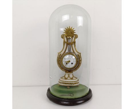 A French mantel clock, the 7.5 cm diameter enamel dial, signed Causard Hger du Roy A Paris, fitted an eight day movement, in 