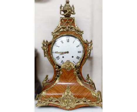 A Louis XV style bracket clock, the 24 cm enamel dial with Roman numerals, fitted an eight day movement, in a kingwood case w