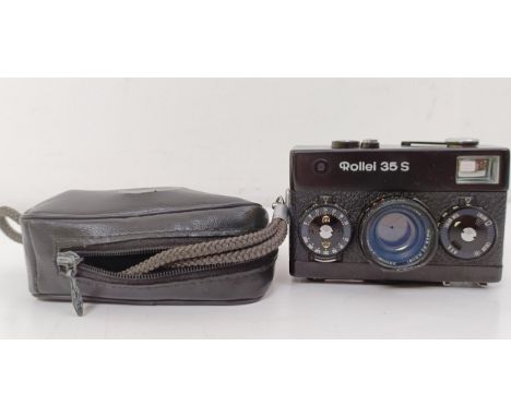 A Rollei 35S camera, with carrying caseAppears to have been dropped at some point, due to a dent around the lens, just to the