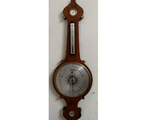 A Victorian wheel barometer, by J Hughes, London, with silvered dials, in a rosewood case, 114 cm high, and another wheel bar