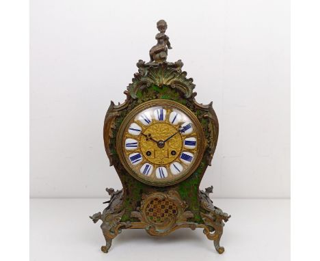 A Louis XV style mantel clock, the 13.5 cm diameter gilt metal dial with enamel numerals, fitted an eight day movement, in a 