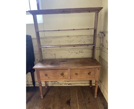 A pine dresser, 131 cm wide, a wall shelf, an easel, a fire surround, and a tray topped table (5) 