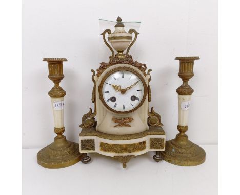 A late 19th century clock garniture, the clock having a 7 cm diameter enamel dial, with Roman numerals, in a marble case, wit
