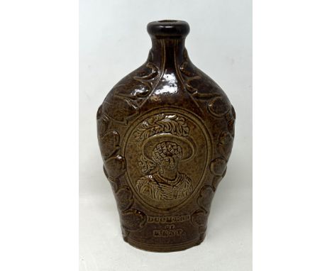 A 19th century brown glazed bottle, decorated portrait of The Duchess of Kent and Queen Victoria, 21 cm high 