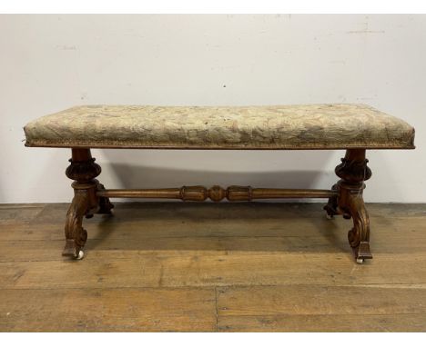 A 19th century walnut duet stool, with a tapestry seat, 116 cm wideTapestry very faded 