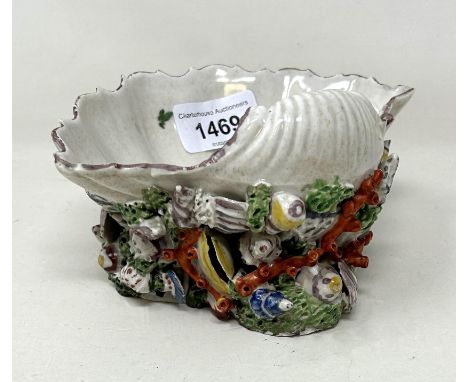 A mid-18th century Plymouth Porcelain shell salt, with enamel colours, 15.5 cm wideGeneral chips and losses as you would expe