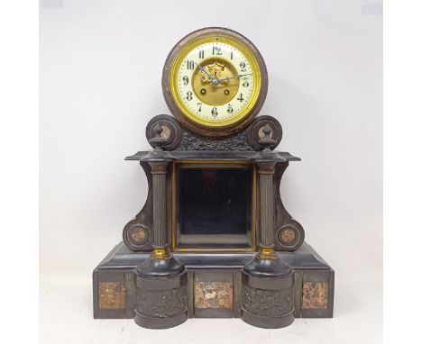 A mantel clock, with an enamel dial, and a twin train eight day movement, striking on a bell, with a mercury pendulum, in a p