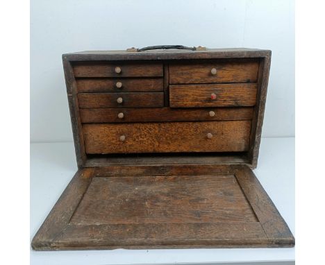 Assorted clock makers and other tools, in a cabinet 44 cm wide 