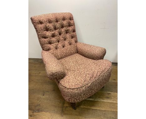 A Howard style button back armchair 