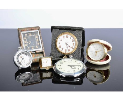 Six small clocks and travel timepieces, including a Jaeger-LeCoultre, case in poor condition but appears to run, a large Smit