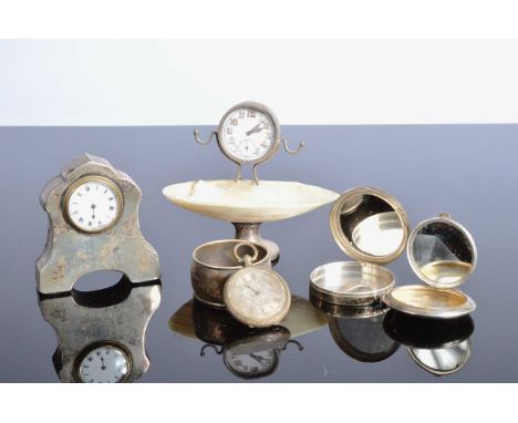 Two small silver mounted clocks and other items, As Found, one small stand with shell, the other dated 1912, along with a sil