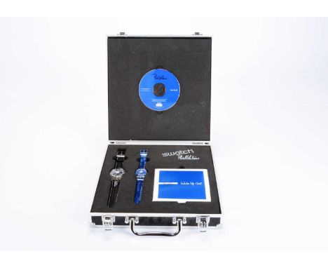 A limited edition Swatch watch Phil Collins "Wake Up Call" set, the decroated flight case with number 9441 or 9999, containin