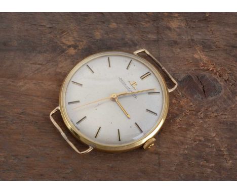 A circa 1960s Jaeger- LeCoultre manual wind 18ct gold cased wrist watch head,  34mm with gold coloured dial having batons, th