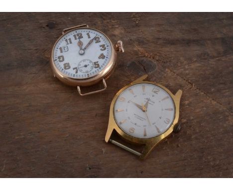 An early 20th century 9ct gold presentation wrist watch head, together with a gold plated Mellrose automatic watch and a gold
