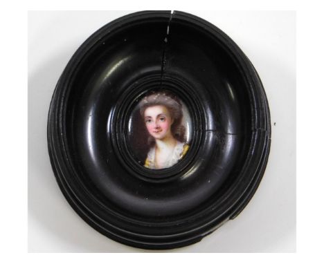 An 18th/19thC. miniature enamel portrait of a lady wearing lace-trimmed yellow dress in oval hardwood frame. Image size 28mm 