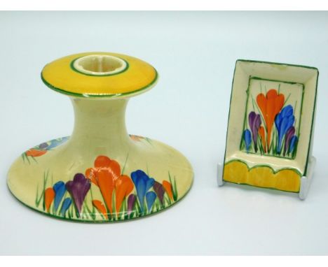 A Clarice Cliff Bizarre crocus design candle holder, 3in high x 4.5in across base, twinned with a Clarice Cliff crocus ashtra