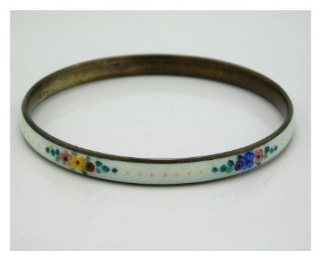 A guilloche enamelled silver bangle with floral decor, internal measurement 64mm