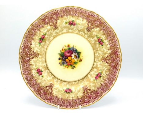 A Royal Worcester porcelain plate with hand painted floral centre signed by John Freeman, 10.25in diameter