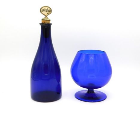 A 19thC. Bristol blue decanter with later Mother of Pearl whisky stopper twinned with a hand blown blue brandy glass