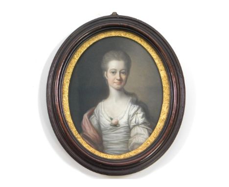 Hugh Hamilton (1739-1808), a miniature oil portrait of a lady wearing satin dress &amp; rose set within a wooden, oval frame.