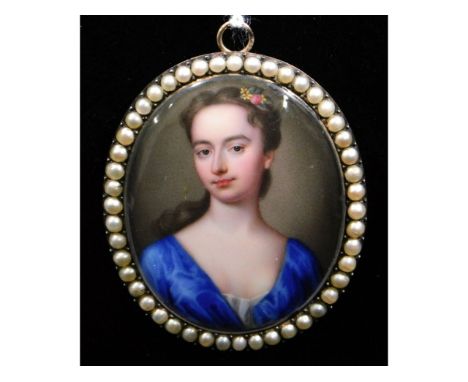 Christian Friedrich Zincke (1683-1767), a miniature enamel portrait miniature of a lady wearing blue satin dress with flowers