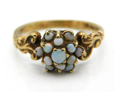 A 9ct gold opal set ring with carved shoulder decor, 2.1g, size S 