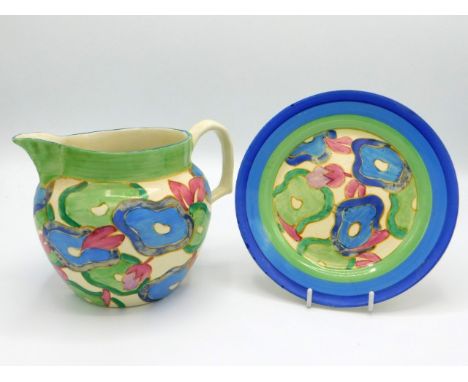 A Clarice Cliff Bizzare blue chintz design jug &amp; plate, jug 6.75in wide x 5in high, jug has small, very faint hairline to