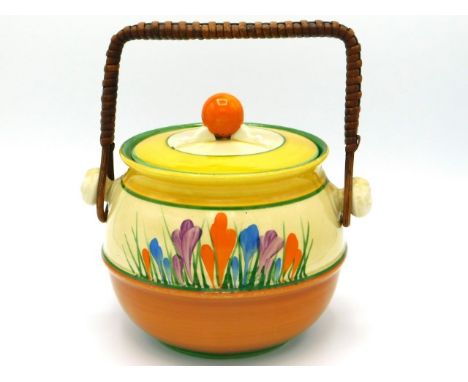 A Clarice Cliff Bizarre crocus design biscuit barrel, 5.75in high to lid finial