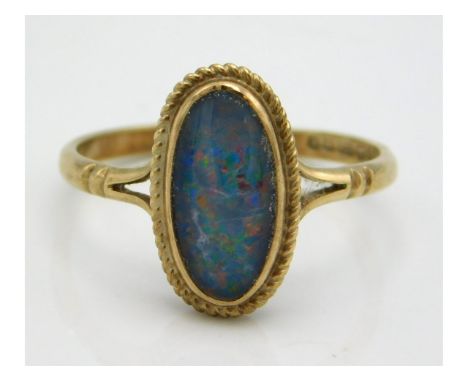A 9ct gold ring set with black opal doublet, 1.7g, size M 