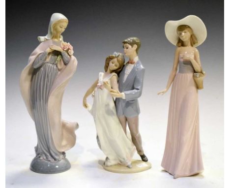 Lladro figure group of a dancing couple, another of a cloaked figure, and a Nao figure, 32cm high and smaller