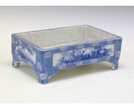 Japanese blue and white bonsai planter, of rectangular form, the recessed panelled sides painted with foliate decoration, on 