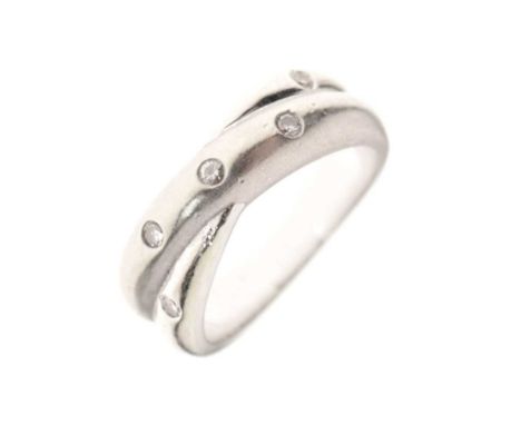 9ct white gold diamond set crossover-style wedding band, size K½, 7g gross approx