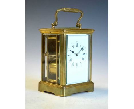Brass cased carriage clock with white Roman dial, two train movement,13cm high (ex.handle), with key