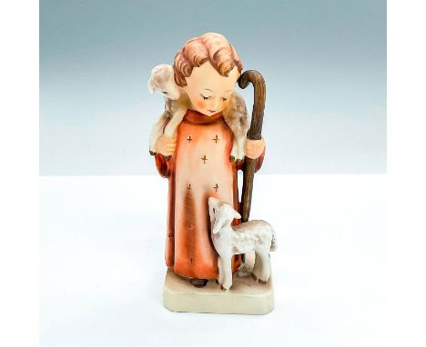 Matte porcelain, hand painted. Young girl in red robe standing with two lambs. 'M. I. Hummel' inscribed on base. Goebel backs