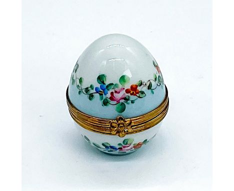 Beautiful hand painted light blue egg with floral designs lining the opening of the box. Has smaller clear perfume bottle tha