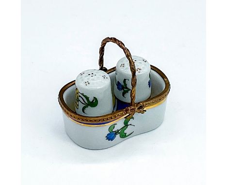 Small trinket depicting a basket with salt and pepper shakers. There are gold, yellow, and blue details along with blue flowe