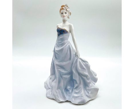 Fine bone china that is the official figurine of the year 1998. Depicts lady in a soft blue strapless dress with gold gilt to