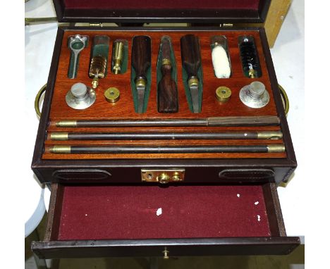 A set of 12-bore shotgun cleaning equipment, including William Powell snap caps, oil bottles, cleaning rods, turned screws, i