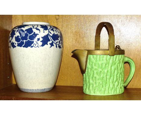 A late-19th century Coalport teapot with moulded bark effect, glazed in green, the fittings by Hukin and Heath, with a wicker