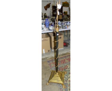 A Regency-style gilt metal adjustable electrified oil lamp stand on paw feet. 