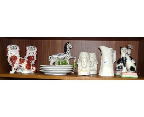 A pair of liver and white Staffordshire dogs, 8cm high, (crazing, hairline cracks), a pair of reproduction Staffordshire-styl