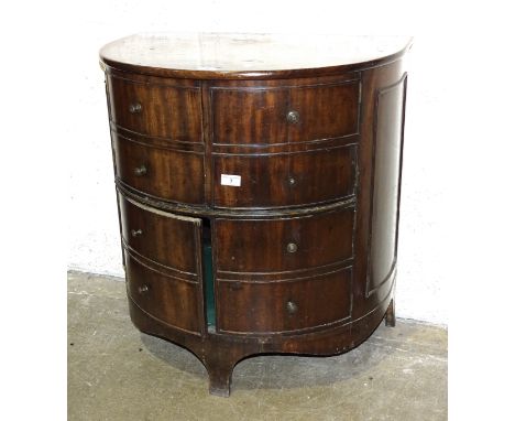 A Georgian mahogany half-round commode, converted and having four cupboard doors, on bracket feet, 69cm wide, 74cm high. 