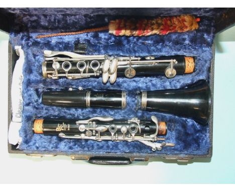 A Boosey &amp; Hawkes Regent clarinet, 26½'' approximately, no. 296360, in fitted case, with clarinet music and two books. 